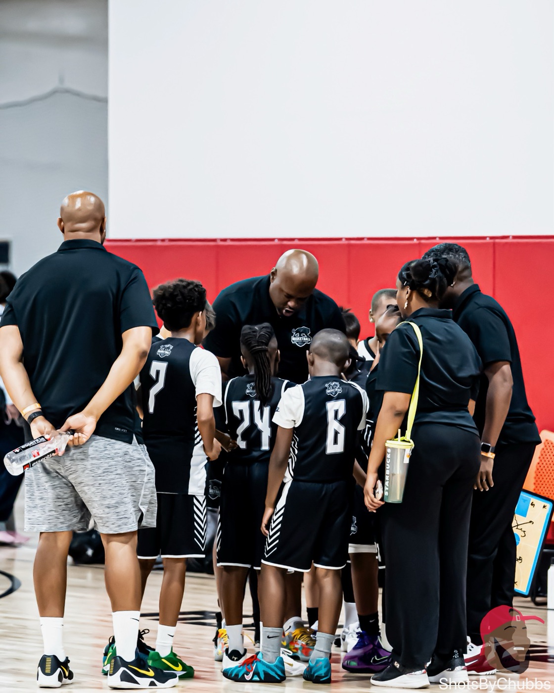 BPA coaches and players in a timeout huddle